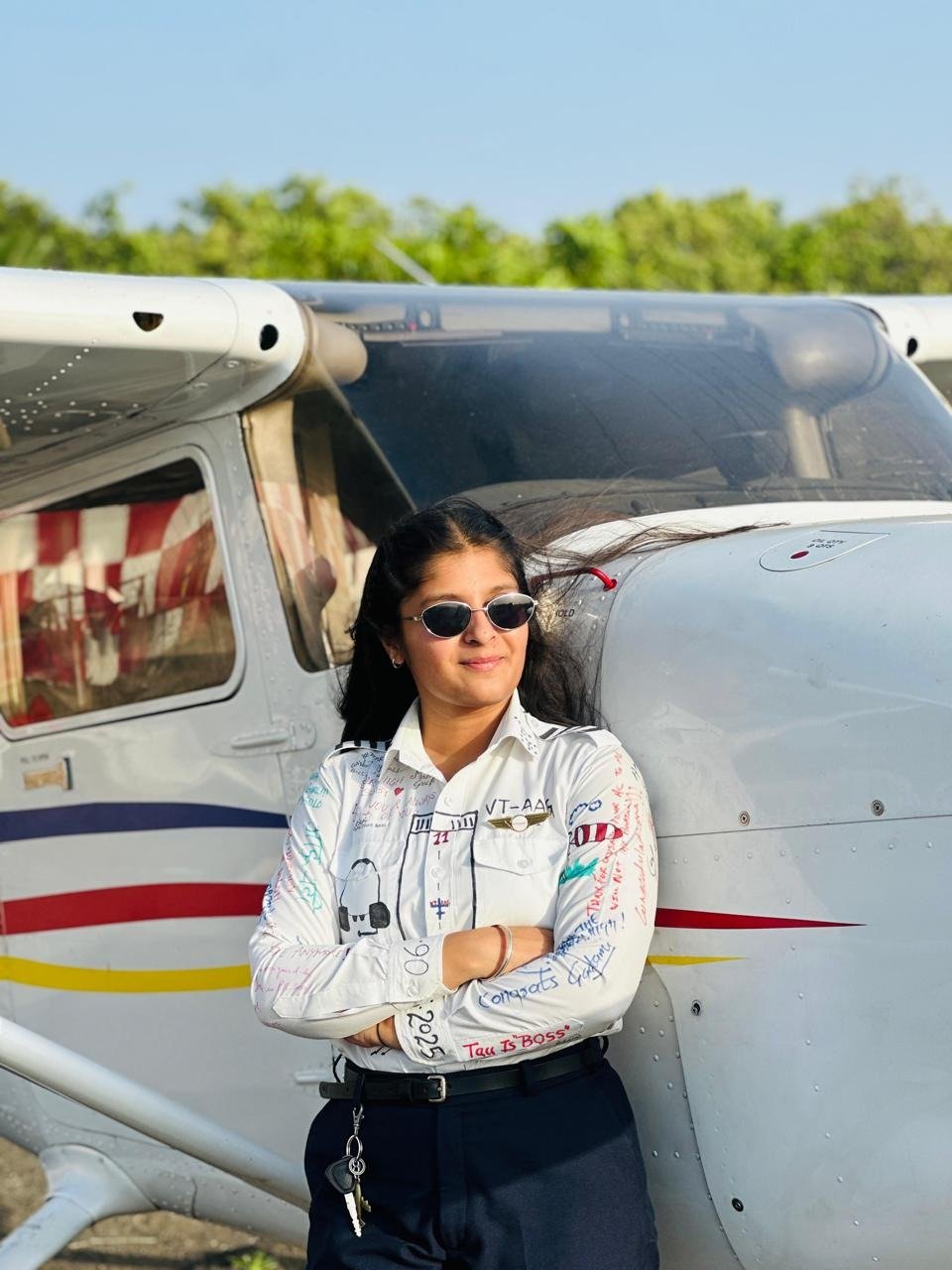 Aviation student beside a training aircraft